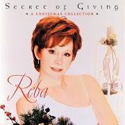 The lyrics UP ON THE HOUSETOP of REBA MCENTIRE is also present in the album Secret of giving (2002)