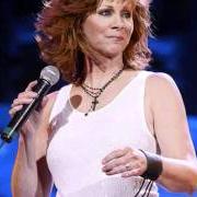 The lyrics SHE'S THE ONE LOVING YOU NOW of REBA MCENTIRE is also present in the album Have i got a deal for you (1990)