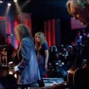 The lyrics RICH WOMAN of ROBERT PLANT is also present in the album Raising sand (2007)