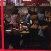 The lyrics EGGS AND SAUSAGE (IN A CADILLAC WITH SUSAN MICHELSON) of TOM WAITS is also present in the album Nighthawks at the diner (1975)