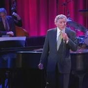 The lyrics SANTA CLAUS IS COMING TO TOWN of TONY BENNETT is also present in the album A swingin' christmas