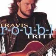 The lyrics I WISH I COULD GO BACK HOME of TRAVIS TRITT is also present in the album T-r-o-u-b-l-e (1992)