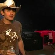 The lyrics IS IT RAINING AT YOUR HOUSE of BRAD PAISLEY is also present in the album Mud on the tires (2003)