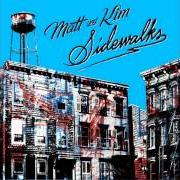 The lyrics AM/FM SOUND of MATT & KIM is also present in the album Sidewalks (2010)