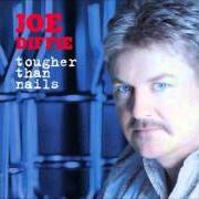 The lyrics AM I of JOE DIFFIE is also present in the album Tougher than nails (2004)